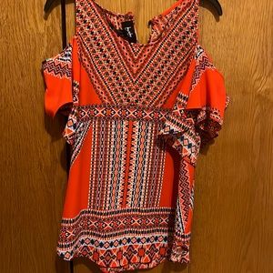 I am selling an off the shoulder multicolored shirt. This is a small in juniors.